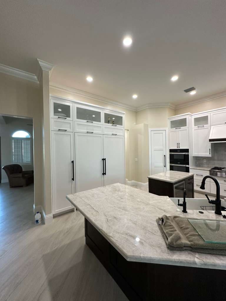 Kitchen with light cabinets and painted ceiling
