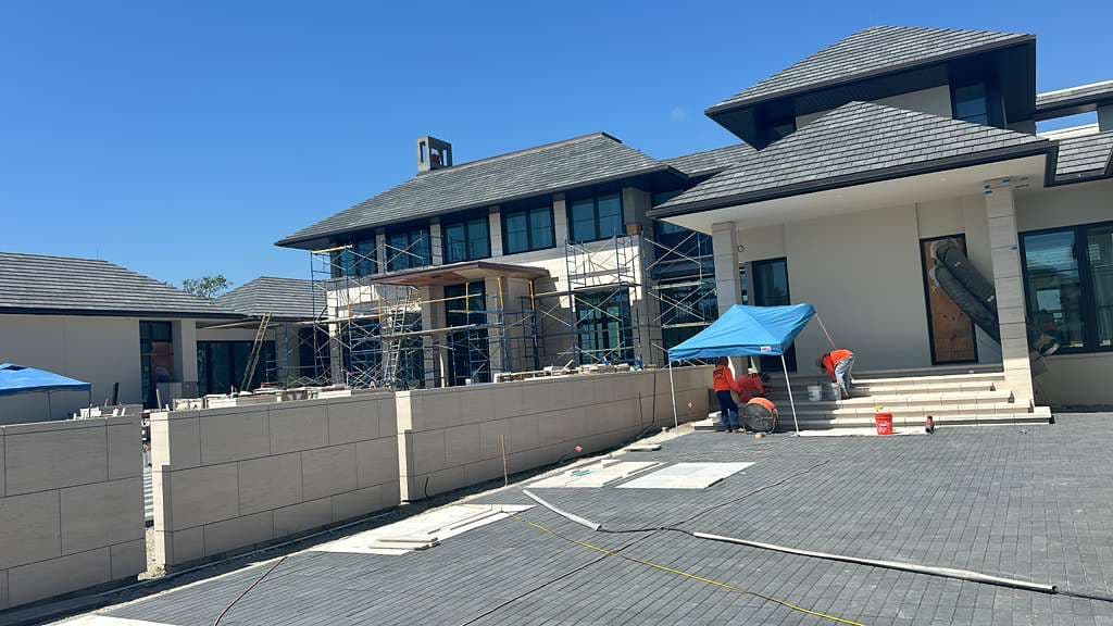 Exterior painting project with light walls and dark trim